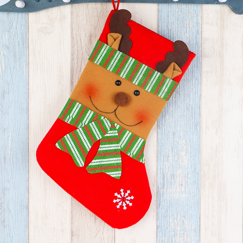 Four cloth stocking designs: bear, reindeer, Santa and snowman