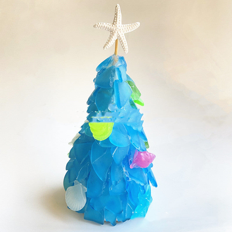 Mini blue Christmas tree with PVC branches that fan out