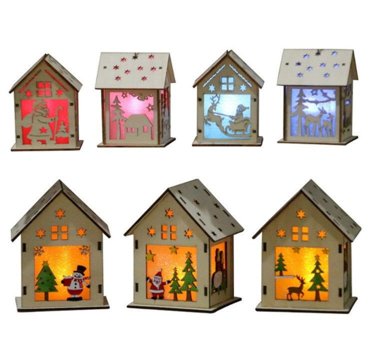 Deer cart wooden Christmas scene lit by its candle light