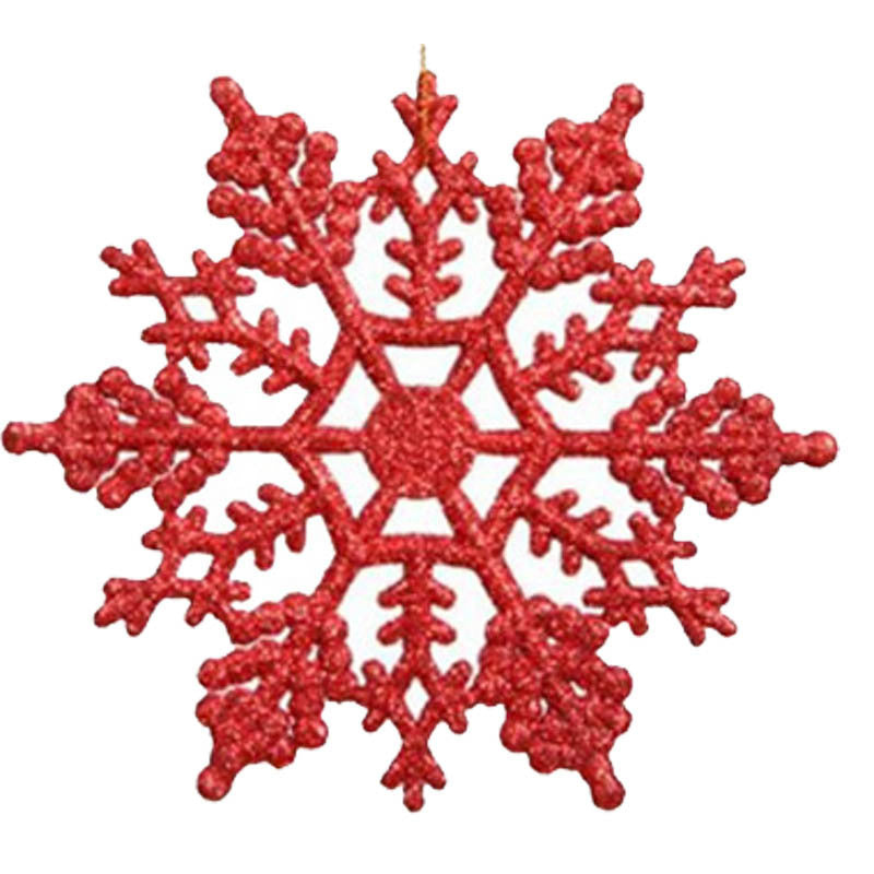 Fine cut detail along one arm of an acrylic snowflake