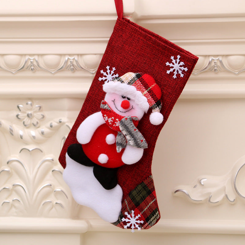Set of four Christmas stocking gift bags in four characters
