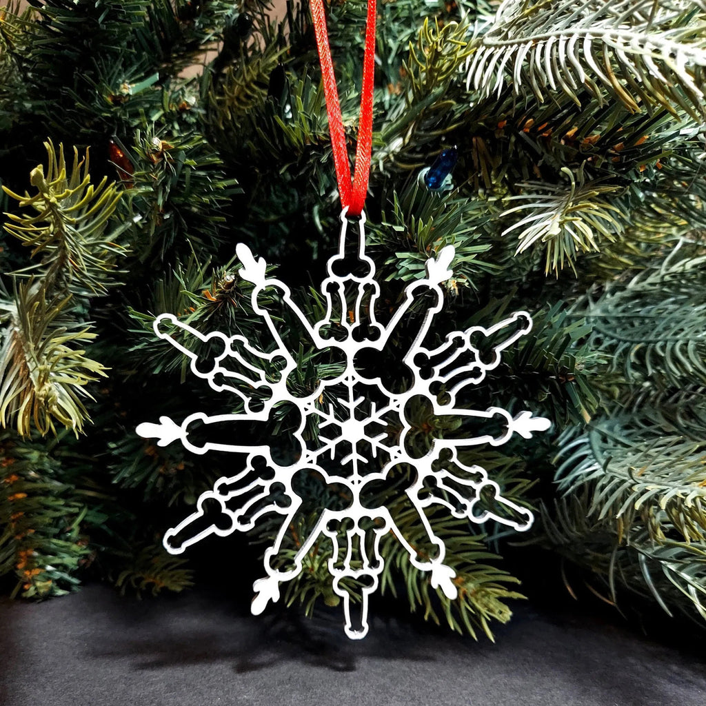 Boxwood snowflake Christmas ornament in a natural wood finish, 4.3 inches across