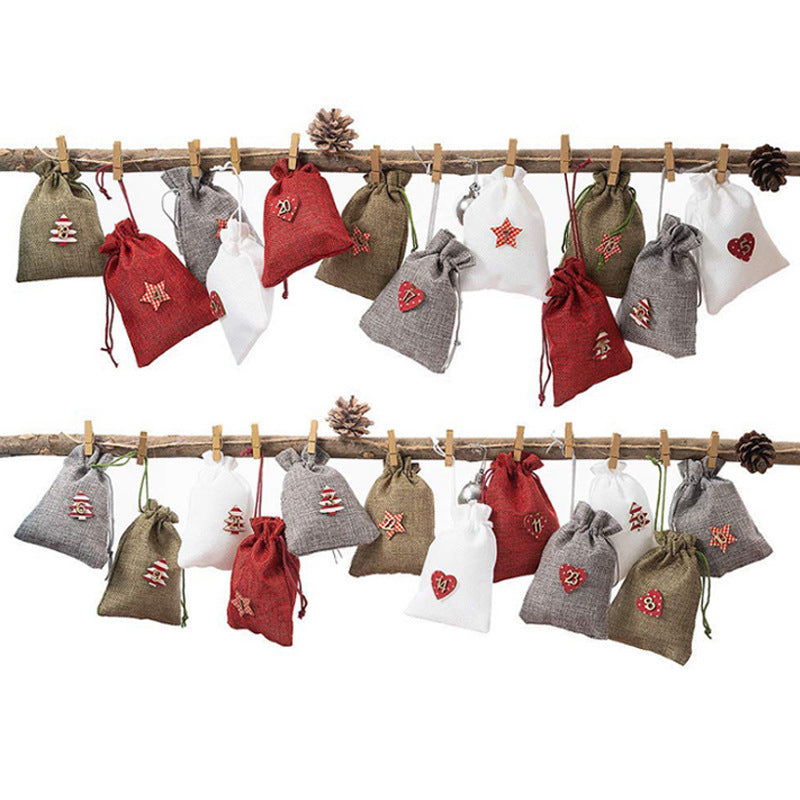 Twenty four linen advent calendar bags measuring 3.9 by 5.5 inches each