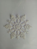 Twelve acrylic snowflake ornaments make up one complete pack