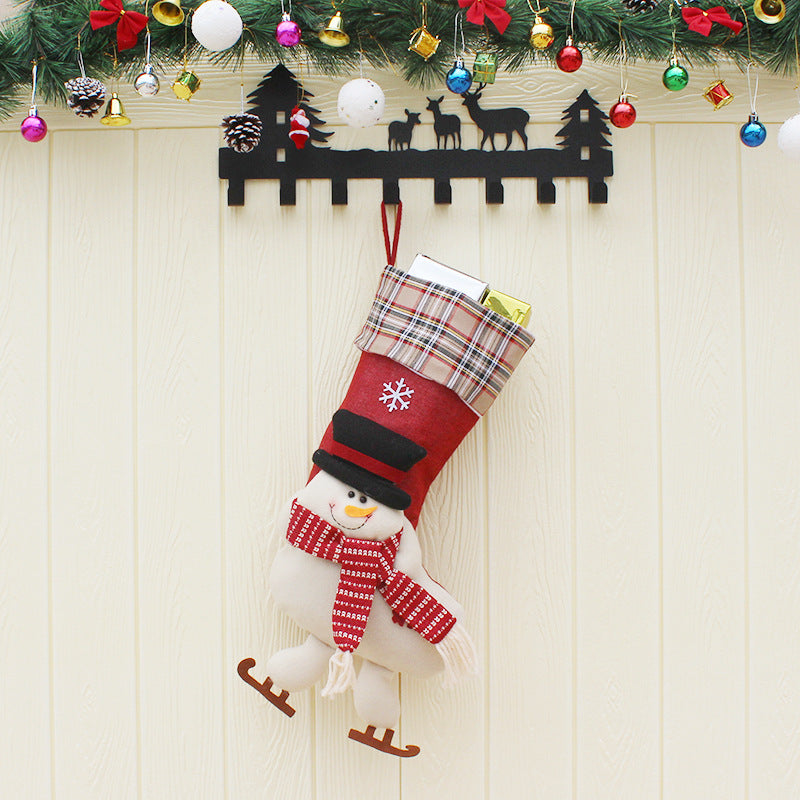 Set of three Christmas stockings in Santa, snowman and reindeer designs