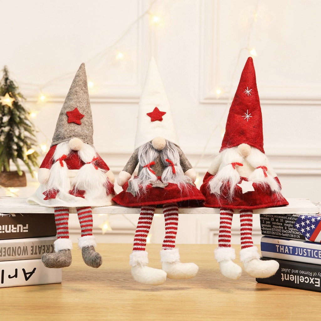Faceless gnome Christmas doll with a gray cloth hat, seated figure