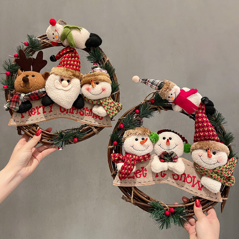 Natural rattan Christmas wreath trimmed with Santa, a snowman and a reindeer