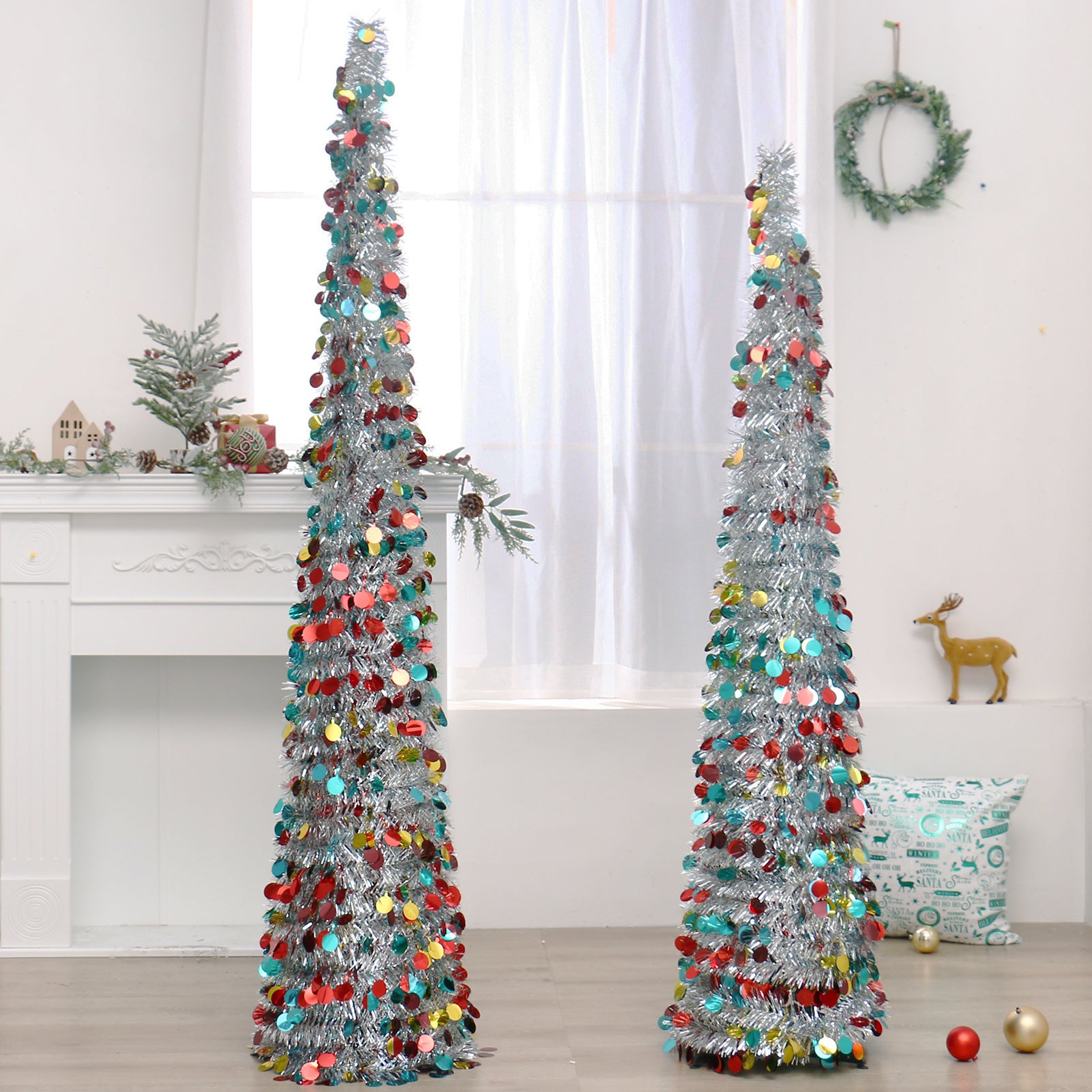 Collapsible artificial Christmas tree in PET, decorated and standing full height