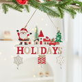 Wooden Christmas card ornament with lettering cut into the wood