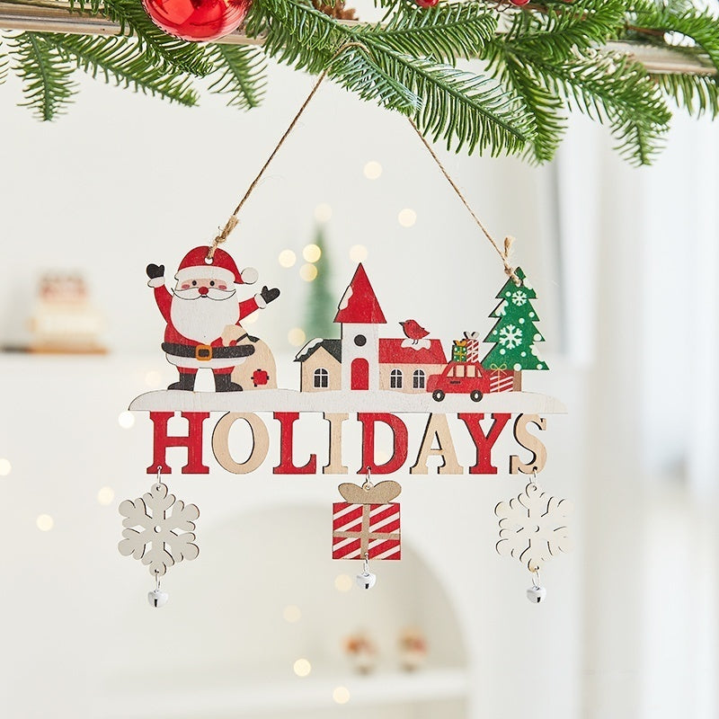 Wooden Christmas card ornament with lettering cut into the wood