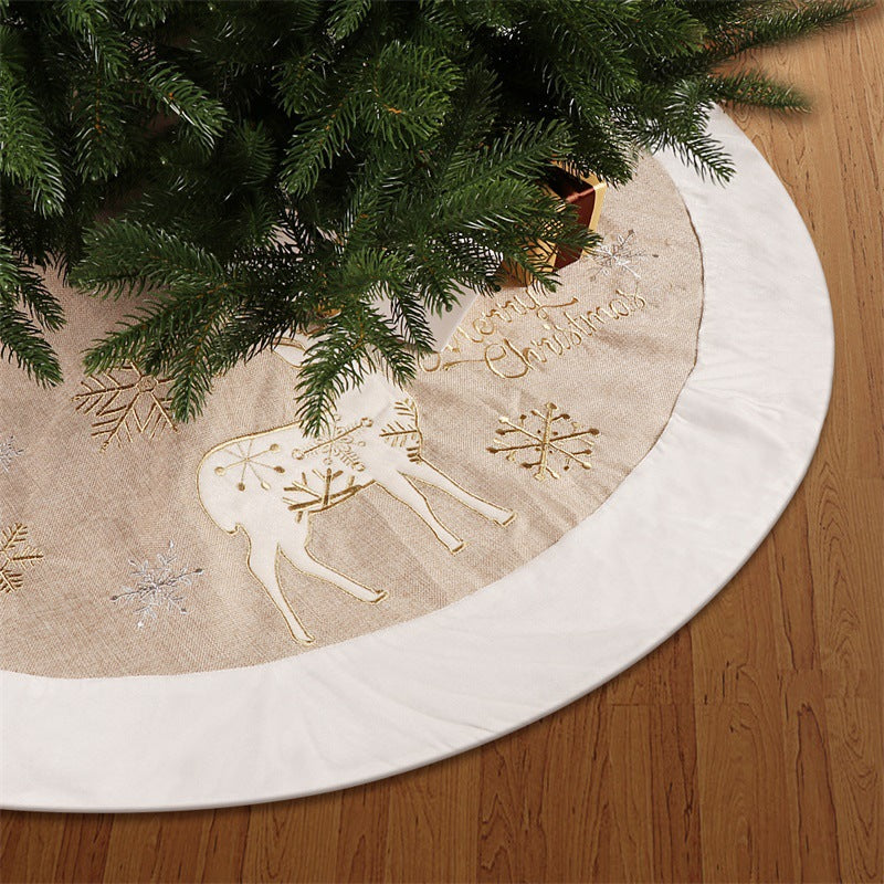 Gold and white linen Christmas tree skirt measuring 48 inches across