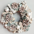 Small 9.1 inch silver wreath next to the 13.4 inch size