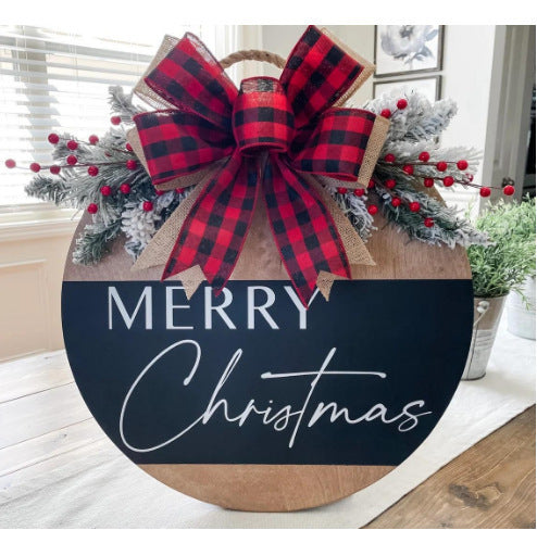 Christmas door sign cut from wooden density board rather than card