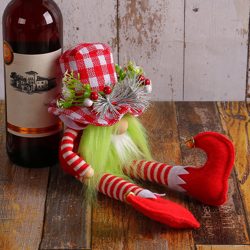 Cloth Christmas doll with long dangling legs and a long beard