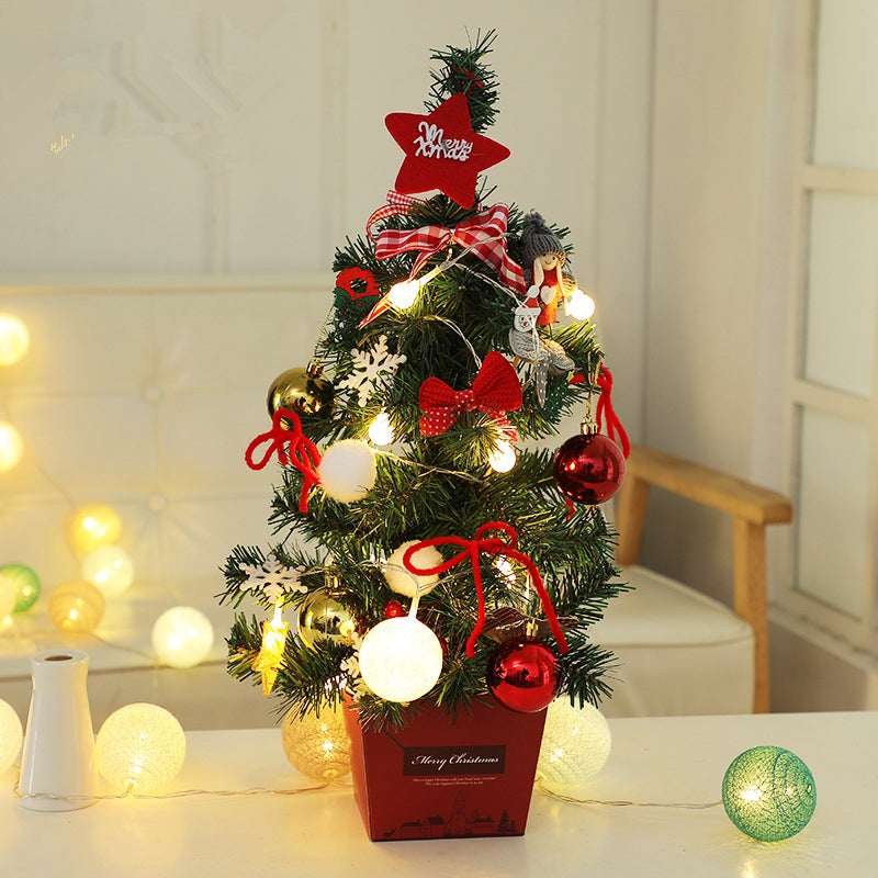 Mini PVC Christmas tree offered in gold or red, one per order