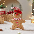 Boy retractable gingerbread man doll that stretches out and springs back
