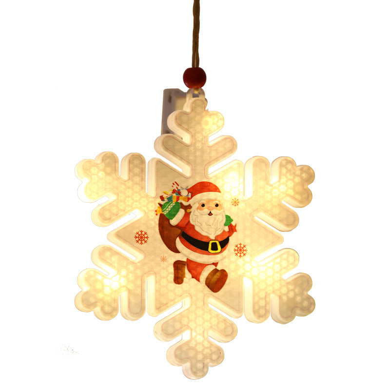 Snowflake shaped window light that mounts to glass with a suction cup