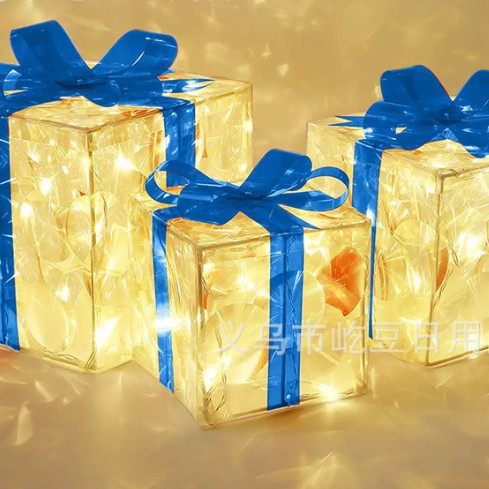 Blue glowing Christmas gift box decoration that lights up on its own