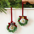 Christmas bell garland molded from PVC with pine cones, berries and green leaves