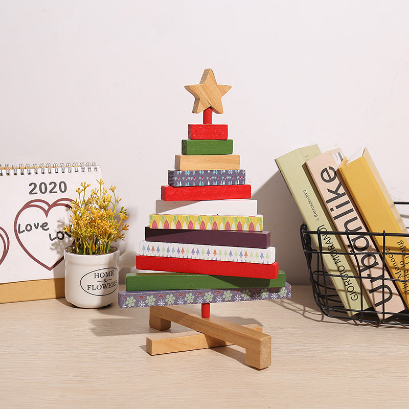 Carved wood Christmas tree decoration with tiers that rotate on a central post