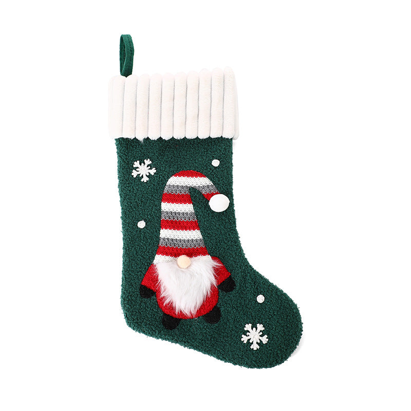 Stitched Santa figure sewn onto the cloth Christmas stocking front