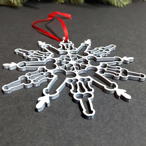 Single metal snowflake pendant showing the full cut snowflake outline