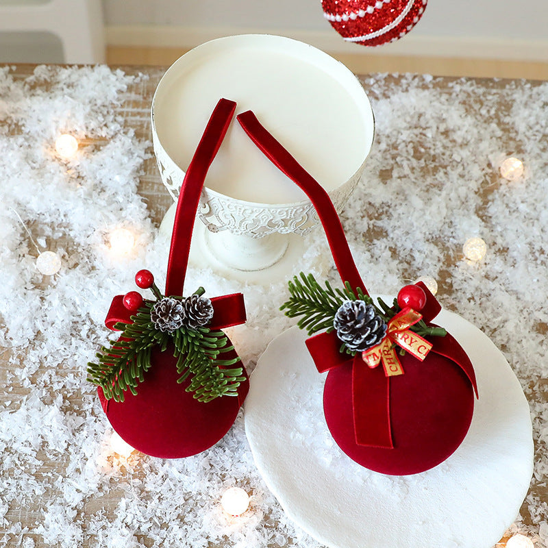 Flocked bow with double bells, one of seven wine red shapes