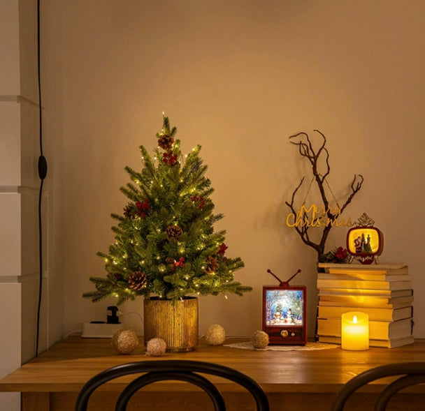 Light string fitted through the branches of the pre-lit Christmas tree
