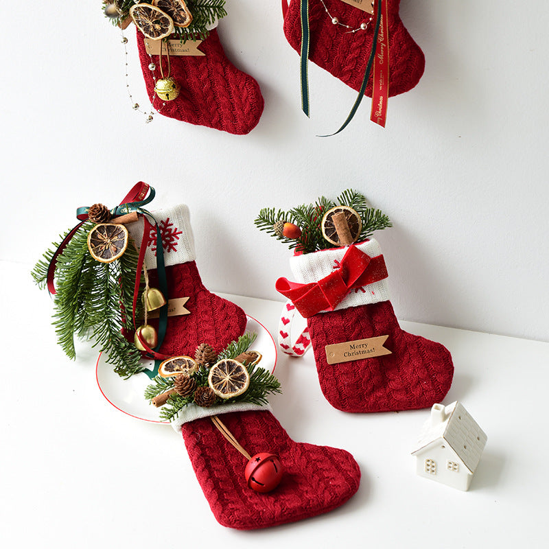 Gold bell Christmas stocking in knitted cloth with a bell at the cuff