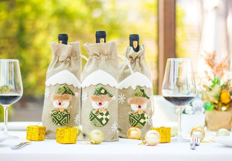Christmas wine bottle sleeve sewn from cloth and artificial wool