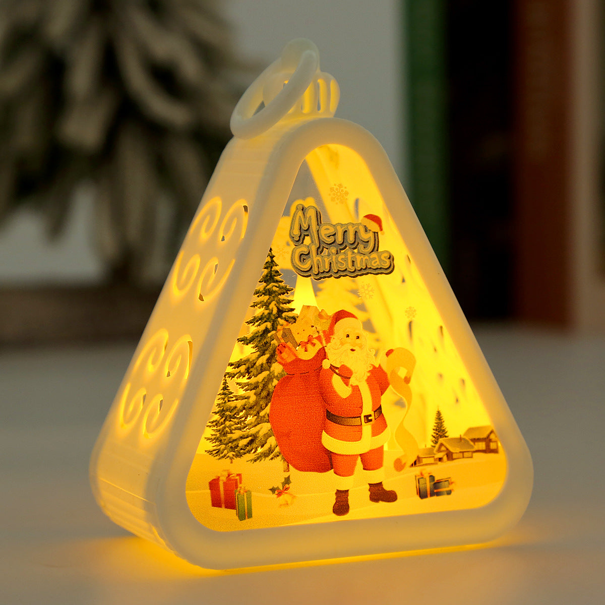 Triangular red night light with a snowman figure under the glass