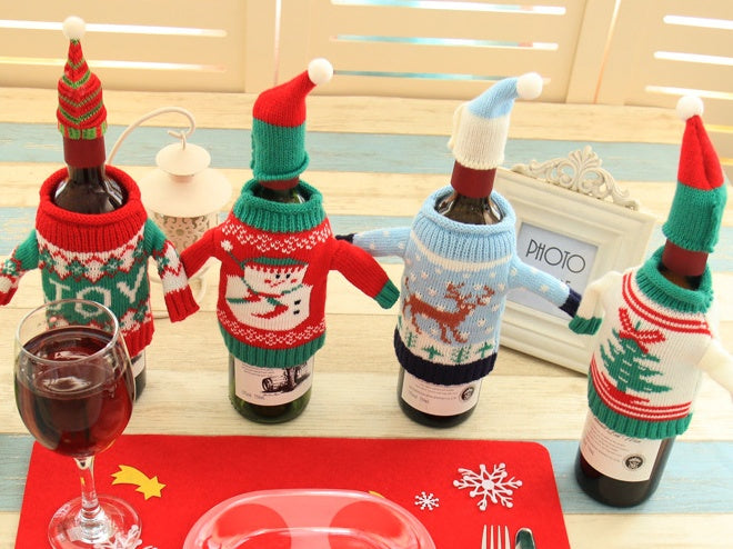 Snowman knitted bottle cover finished with a pom-pom topped hat