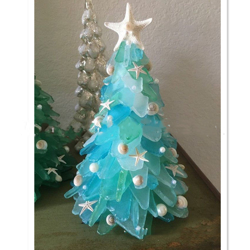 Blue PVC needles on the small tabletop Christmas tree