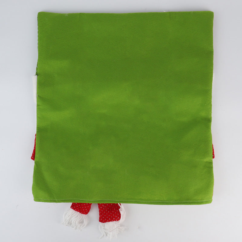 Red Christmas chair cover finished with knitted embroidery, pom-poms and bells
