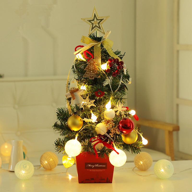 Mini Christmas tree with elf dolls, bells and stars worked into the branches