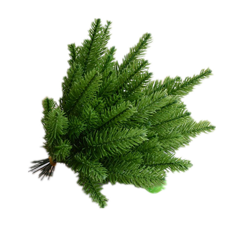 Artificial pine sprig fanned out to show its green foliage tips