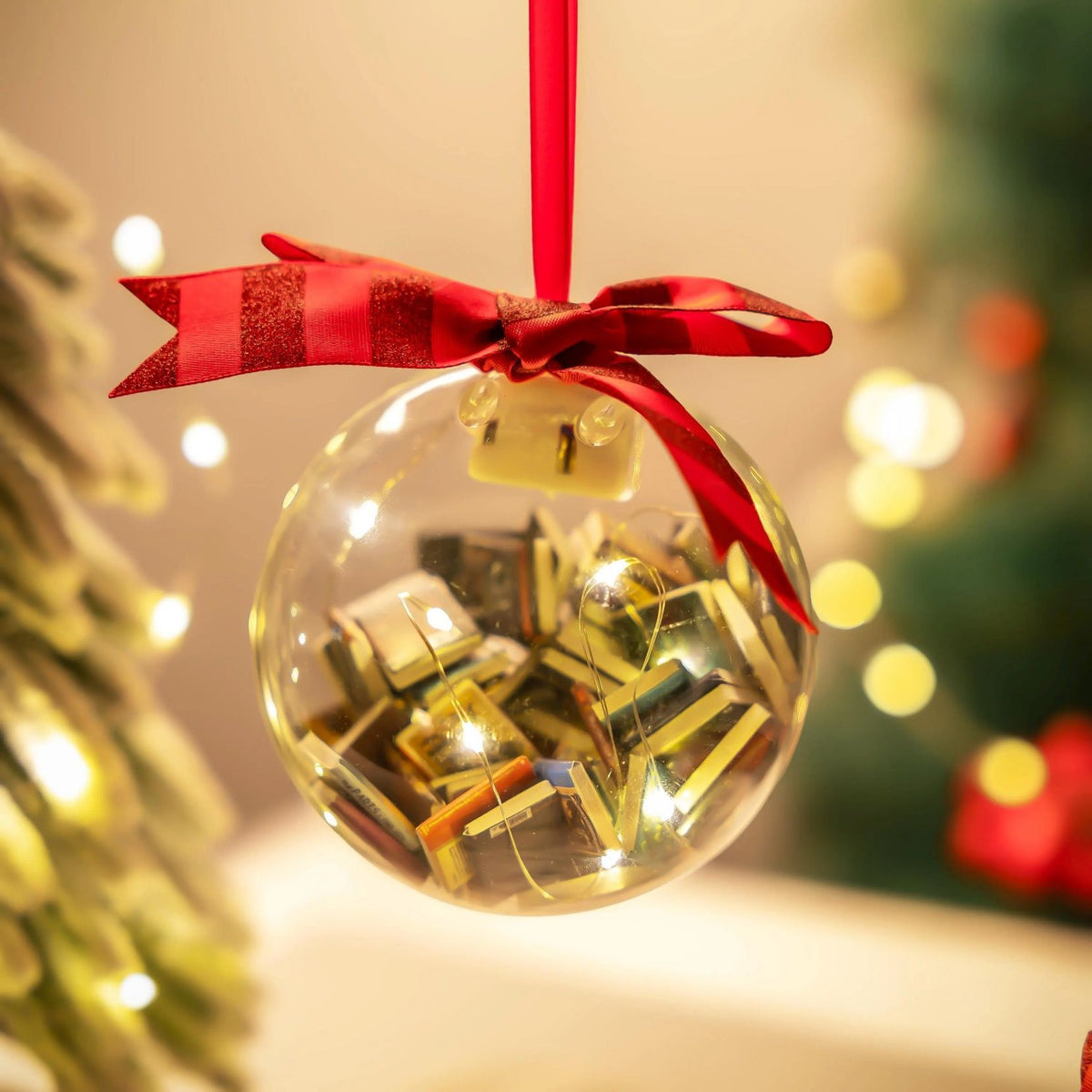 Christmas ball ornament with a stacked book design on the surface