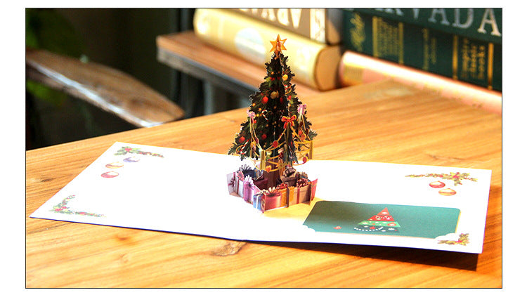 Hollow carved Christmas greeting card supplied as one folding card