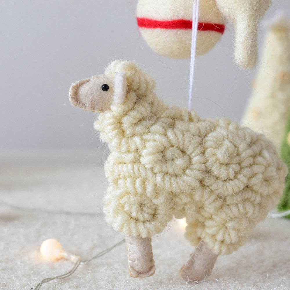 Wool felt lamb ornament shaped in plain beige for a Christmas tree