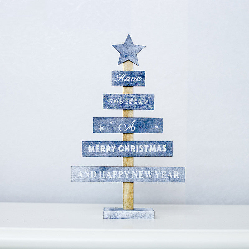 Gray painted wood Christmas hanging sign with the grain showing through