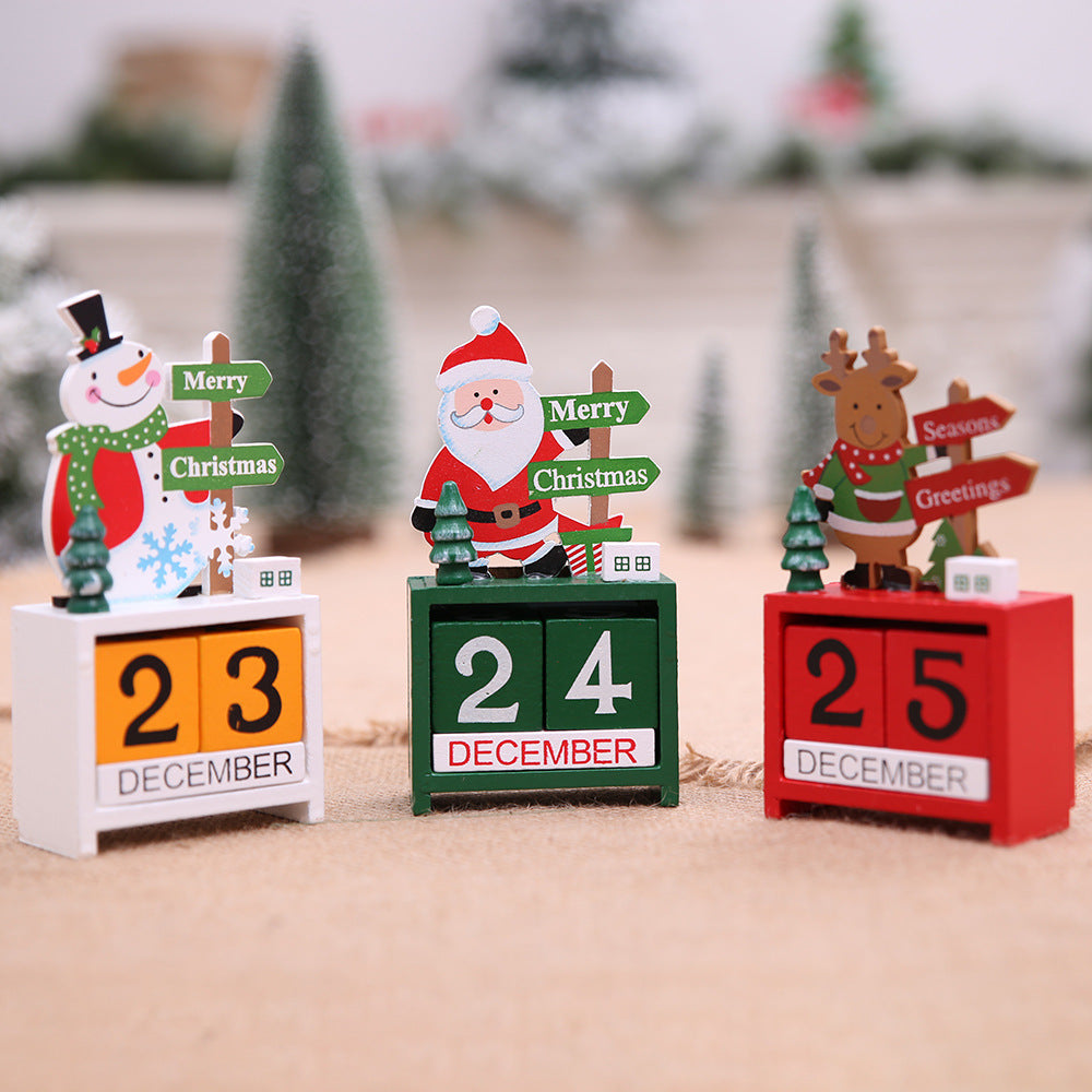 Wooden Christmas desk calendar with a carved Santa figure on top