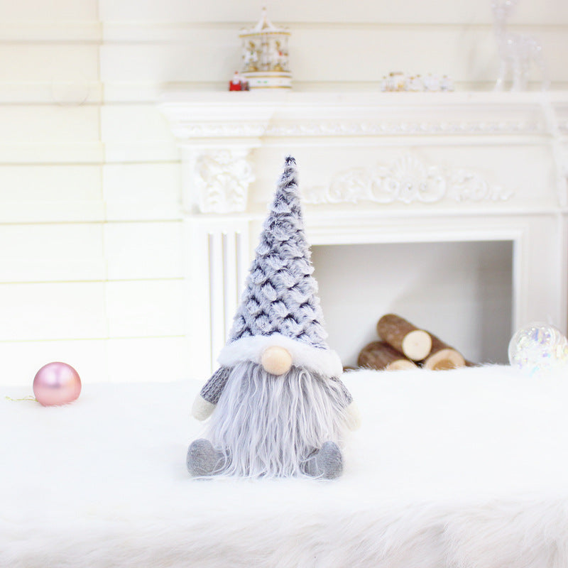 Faceless gnome plush dolls offered in pink, white and gray