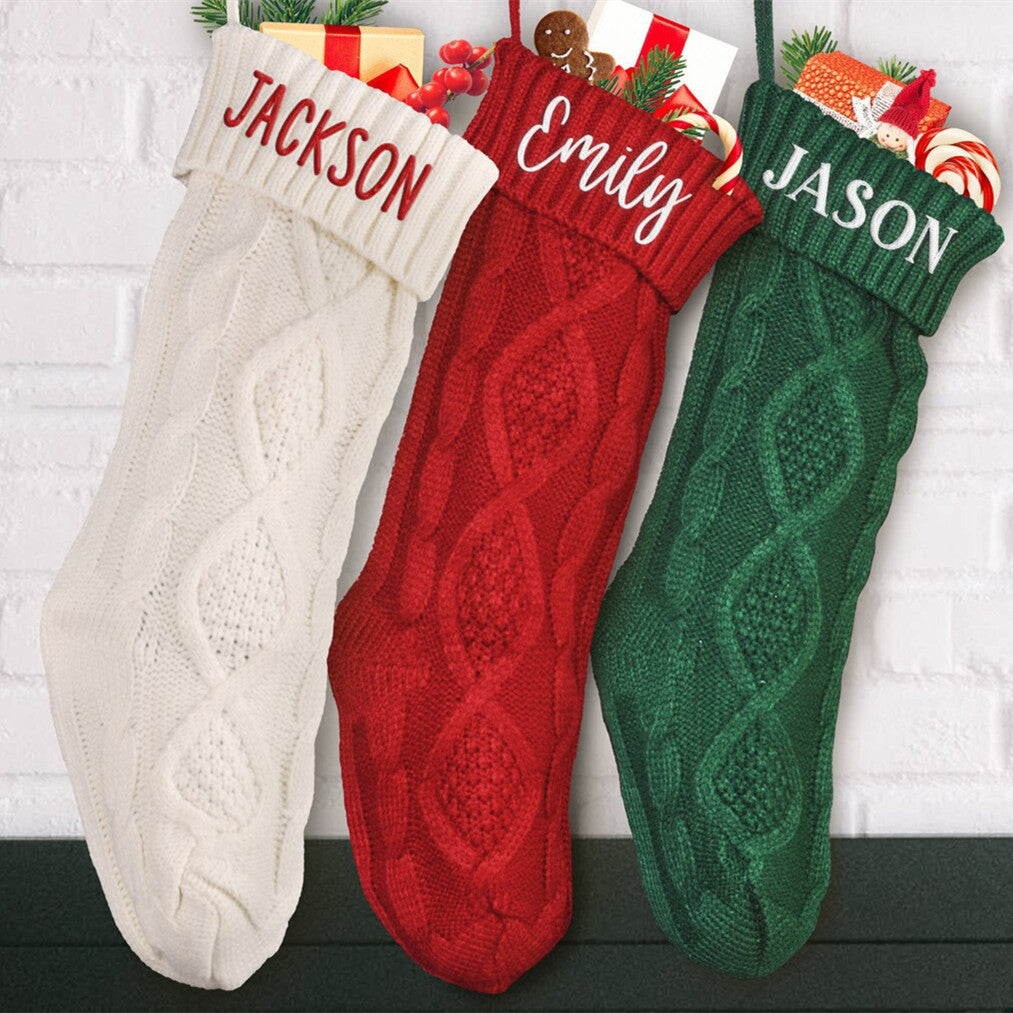 Red knitted Christmas stocking in 100 percent acrylic with an embroidered cuff