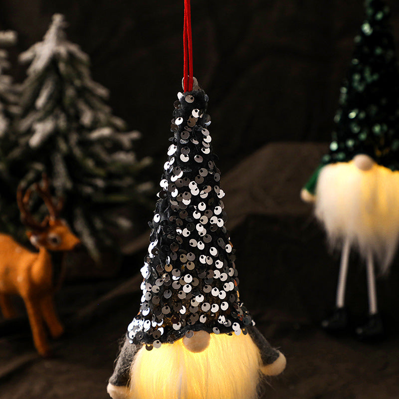 All three colors of the faceless gnome doll, silver, red and dark green