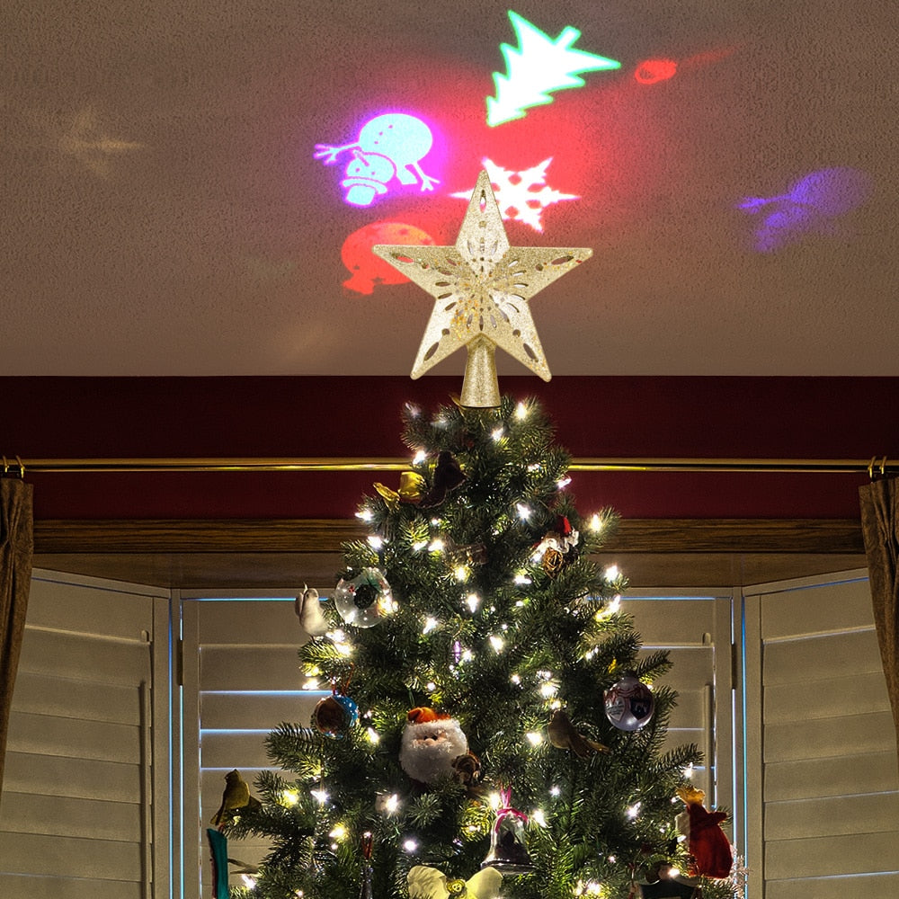 Silver LED star Christmas tree topper with a built in snowflake projector