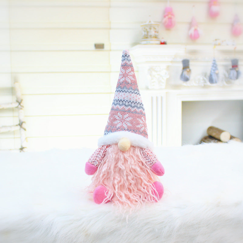 Pink and white faceless gnome plush dolls from the same range