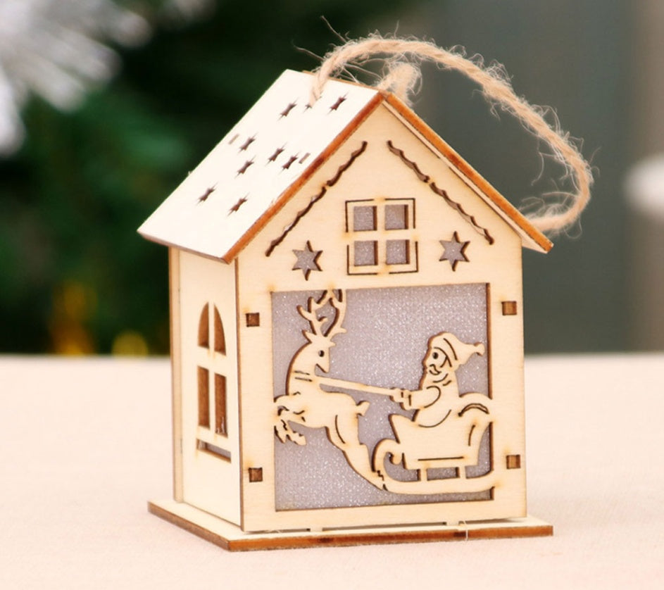 Small house wooden Christmas scene with a four color candle light