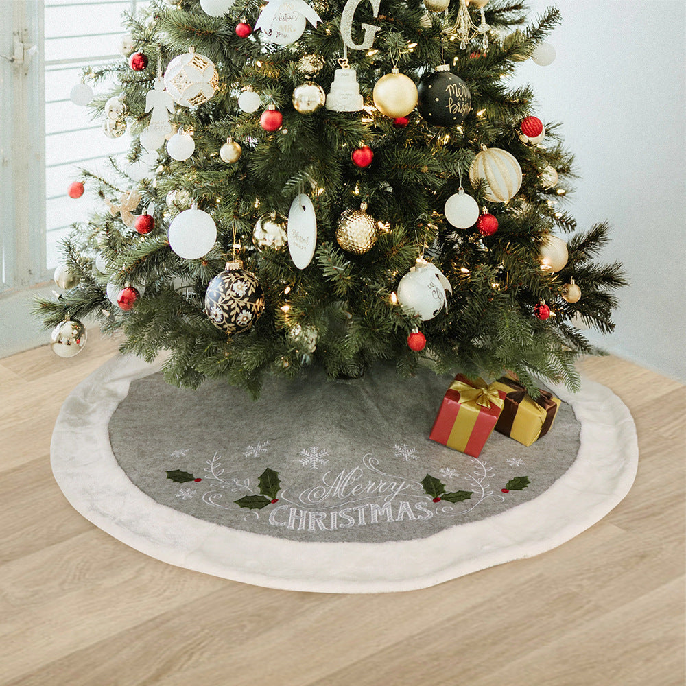 Gray flannel Christmas tree skirt with a printed leaf design