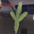 Layered needle tips on an artificial green Christmas pine sprig