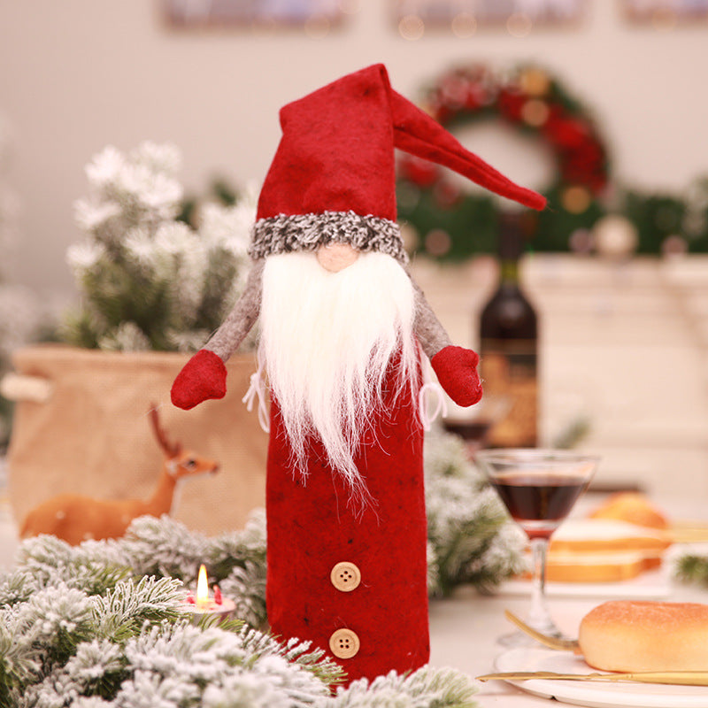Faceless doll bottle cover with an open base that pulls over a bottle